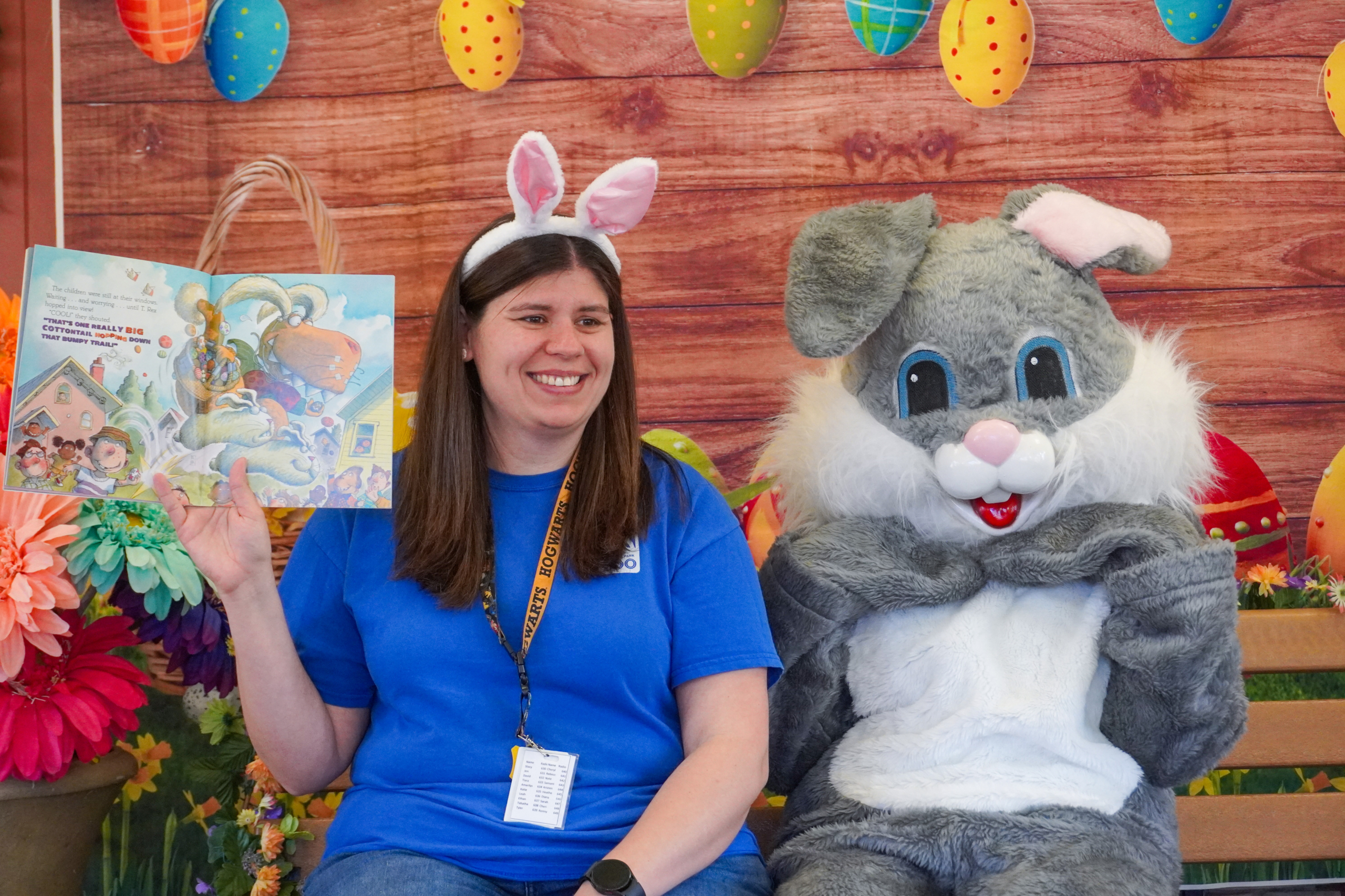 Easter Bunny and Zoo staff member reading a book.