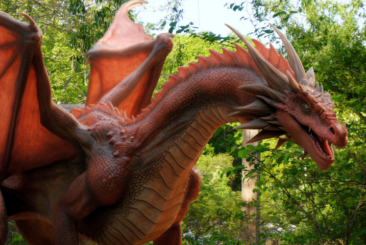 animatronic red dragon in the woods