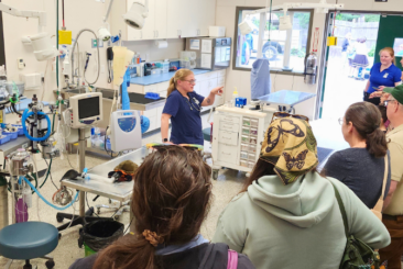 Zoo's veterinary clinic; Lead veterinarian giving a tour of building to the public